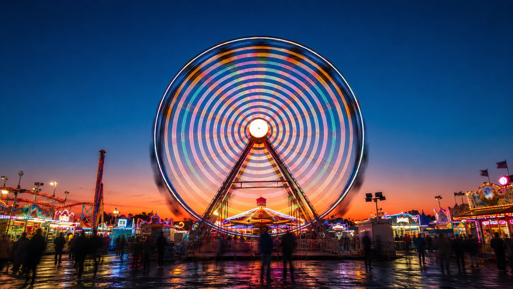 A ferris wheel glowing against the evening sky